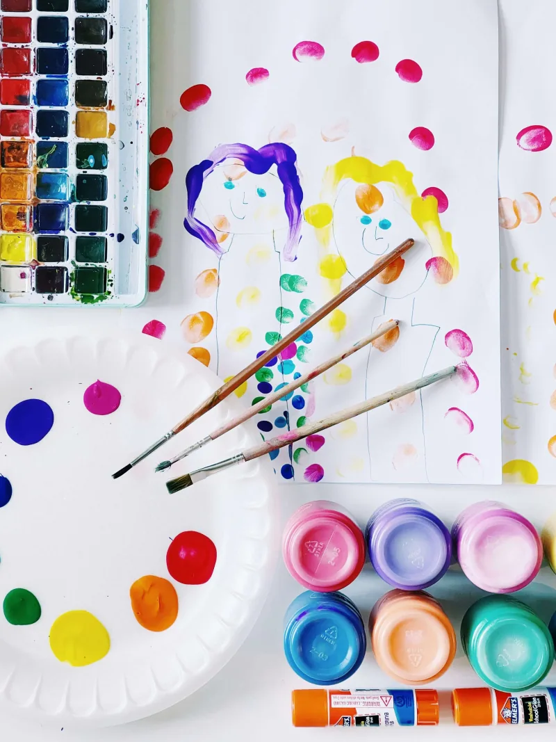 Children's artwork and paints representing the RestartU medical support project